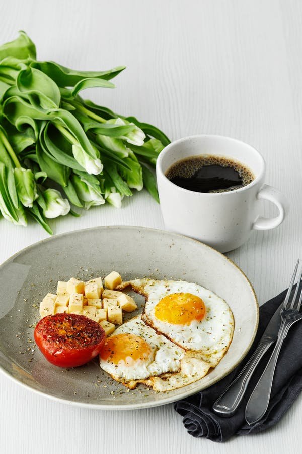 Keto-breakfast-with-fried-eggs-tomato-and-cheese-v.jpeg