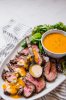 Beef-Tenderloin-with-Herbed-Steak-Sauce_v.jpeg